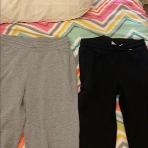 Two pairs of sweatpants one black one gray